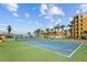 Well-maintained tennis court ready for a friendly game with lush landscaping at 5445 Gulf Blvd # 210, St Pete Beach, FL 33706