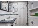Bathroom with vanity, floral wallpaper, and modern fixtures at 5919 35Th N Ave, St Petersburg, FL 33703