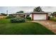 Charming single-story home featuring brick accents, well-maintained landscaping, and an attached two car garage at 5919 35Th N Ave, St Petersburg, FL 33703