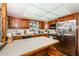 Bright kitchen with wood cabinets, stainless appliances, and a large island for prepping food at 5919 35Th N Ave, St Petersburg, FL 33703