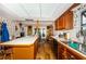Open kitchen with an island, wood cabinets, and a view into the dining area with backyard access at 5919 35Th N Ave, St Petersburg, FL 33703
