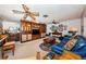 Spacious living room with a large cabinet for storage, with a TV and many decorative items at 5919 35Th N Ave, St Petersburg, FL 33703