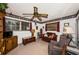 Cozy living room with a ceiling fan, carpeted floors, a flat screen TV, and comfortable seating at 5919 35Th N Ave, St Petersburg, FL 33703
