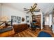 Office space features beautiful hardwood floors, large window, stylish lighting, a ceiling fan, and built-in bookshelves at 5919 35Th N Ave, St Petersburg, FL 33703
