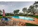 A refreshing pool area with lush greenery and comfortable seating that offers a serene backyard escape at 5919 35Th N Ave, St Petersburg, FL 33703