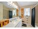 Cozy bathroom with a large mirror, tiled floors, and a shower with a black curtain at 625 Fayette S Dr, Safety Harbor, FL 34695