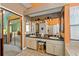 Bathroom featuring a double sink vanity, a large mirror, and a walk-in shower at 625 Fayette S Dr, Safety Harbor, FL 34695