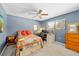 Comfortable bedroom with ample natural light, a ceiling fan, and plenty of space for relaxation and work at 625 Fayette S Dr, Safety Harbor, FL 34695