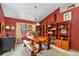 Cozy dining room with a large window seat, wooden table and shelving at 625 Fayette S Dr, Safety Harbor, FL 34695