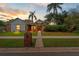 Charming single-story home featuring a well-manicured lawn, brick accents, and mature landscaping with beautiful curb appeal at 625 Fayette S Dr, Safety Harbor, FL 34695