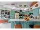 Retro kitchen featuring ample counter space, wood plank accents, and plenty of cabinet storage at 625 Fayette S Dr, Safety Harbor, FL 34695
