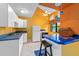 Bright kitchen with unique blue countertops, white cabinets, and modern appliances at 625 Fayette S Dr, Safety Harbor, FL 34695