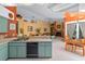 Open kitchen with view to dining area and living room, offering a convenient layout for entertaining at 625 Fayette S Dr, Safety Harbor, FL 34695