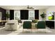 Bright living room showcasing white sofa, modern decor, and dark curtains at 6362 Journey Way, New Port Richey, FL 34655