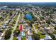Aerial view showcases this perfectly positioned home near schools and a tranquil lake at 6920 13Th N Ave, St Petersburg, FL 33710
