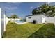 The fully fenced backyard provides a private in-ground pool and tropical landscaping at 6920 13Th N Ave, St Petersburg, FL 33710