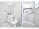 This bathroom features modern vanity and sink, toilet and large glass shower at 6920 13Th N Ave, St Petersburg, FL 33710