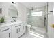 This bathroom features modern vanity and sink, toilet and large glass shower at 6920 13Th N Ave, St Petersburg, FL 33710