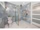 Luxurious bathroom with marbled tile, modern fixtures, frameless shower and contemporary design elements at 6920 13Th N Ave, St Petersburg, FL 33710