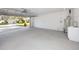 This two car garage features epoxy flooring and bright lighting at 6920 13Th N Ave, St Petersburg, FL 33710