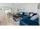 Bright living room with plush seating and access to outdoor dining and pool at 6920 13Th N Ave, St Petersburg, FL 33710
