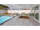 Covered patio featuring lounge seating, a coffee table, and a view of the pool at 6920 13Th N Ave, St Petersburg, FL 33710