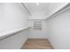 This walk-in closet includes built-in shelving and storage for all of your clothes at 6920 13Th N Ave, St Petersburg, FL 33710