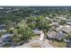 Suburban home surrounded by lush trees in a quiet neighborhood, near urban skyline at 7002 Doreen St, Tampa, FL 33617