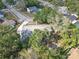 A tranquil residential home with mature trees offers shaded comfort in a peaceful neighborhood at 7002 Doreen St, Tampa, FL 33617