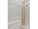 Clean bathroom with a classic white toilet and a shower with gold-trimmed sliding doors at 7002 Doreen St, Tampa, FL 33617