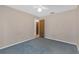 Cozy bedroom featuring neutral tones, ceiling fan, and a glimpse into the closet at 7002 Doreen St, Tampa, FL 33617
