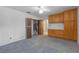 Bedroom featuring built-in storage and access to closet and adjoining area at 7002 Doreen St, Tampa, FL 33617