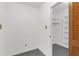 The walk-in closet has built-in shelving, neutral walls, and a gray carpet at 7002 Doreen St, Tampa, FL 33617