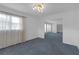 Bright dining room with neutral walls, classic carpeting, and windows at 7002 Doreen St, Tampa, FL 33617