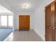 Welcoming foyer with tile flooring, a double-door entry, and a view into the living spaces at 7002 Doreen St, Tampa, FL 33617