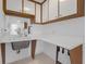 Functional laundry area with a sink, storage cabinets, and counter space, ideal for household chores at 7002 Doreen St, Tampa, FL 33617