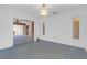 Living room with carpet flooring and access to other areas of the home at 7002 Doreen St, Tampa, FL 33617