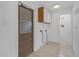 Mud room with tile flooring, utility hook ups, and access to the backyard at 7002 Doreen St, Tampa, FL 33617