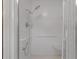 This shower has a shower head, handheld shower, seat, grab bar, and tiled surround at 7002 Doreen St, Tampa, FL 33617