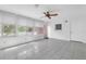 Bright sunroom with tiled floor, ceiling fan, and natural light from large windows at 7002 Doreen St, Tampa, FL 33617