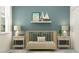 Cozy Bedroom with a wooden crib, matching side tables, and soft, neutral decor at 7546 E 117Th Ln, Palmetto, FL 34221