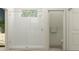 Modern bathroom with a frameless glass shower, white tile, and sleek fixtures at 7546 E 117Th Ln, Palmetto, FL 34221