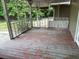 Enclosed back porch featuring a wooden deck at 7806 N Orleans Ave, Tampa, FL 33604