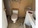 Small bathroom with a toilet and vanity at 7806 N Orleans Ave, Tampa, FL 33604