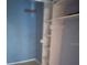 Bedroom closet with blue walls and built in shelving unit at 7806 N Orleans Ave, Tampa, FL 33604