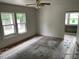 Sunlit bedroom with large windows overlooking the exterior at 7806 N Orleans Ave, Tampa, FL 33604