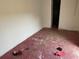 Unfurnished interior room, featuring damaged flooring and white walls at 7806 N Orleans Ave, Tampa, FL 33604