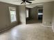 Open living area with tile floors, ceiling fans, and connecting rooms for modern living at 7806 N Orleans Ave, Tampa, FL 33604