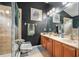 The bathroom features a double sink vanity, shower, and neutral tile flooring, creating a functional space at 8217 Canterbury Lake Blvd, Tampa, FL 33619
