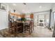 A well-lit kitchen features wood flooring, an island with seating, and stainless steel appliances at 8217 Canterbury Lake Blvd, Tampa, FL 33619